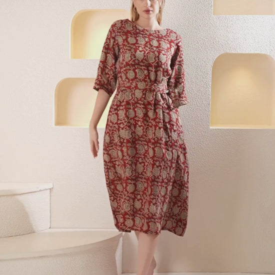 Video showcasing a flowing linen wrap dress, highlighting its elegant and versatile style in motion.
