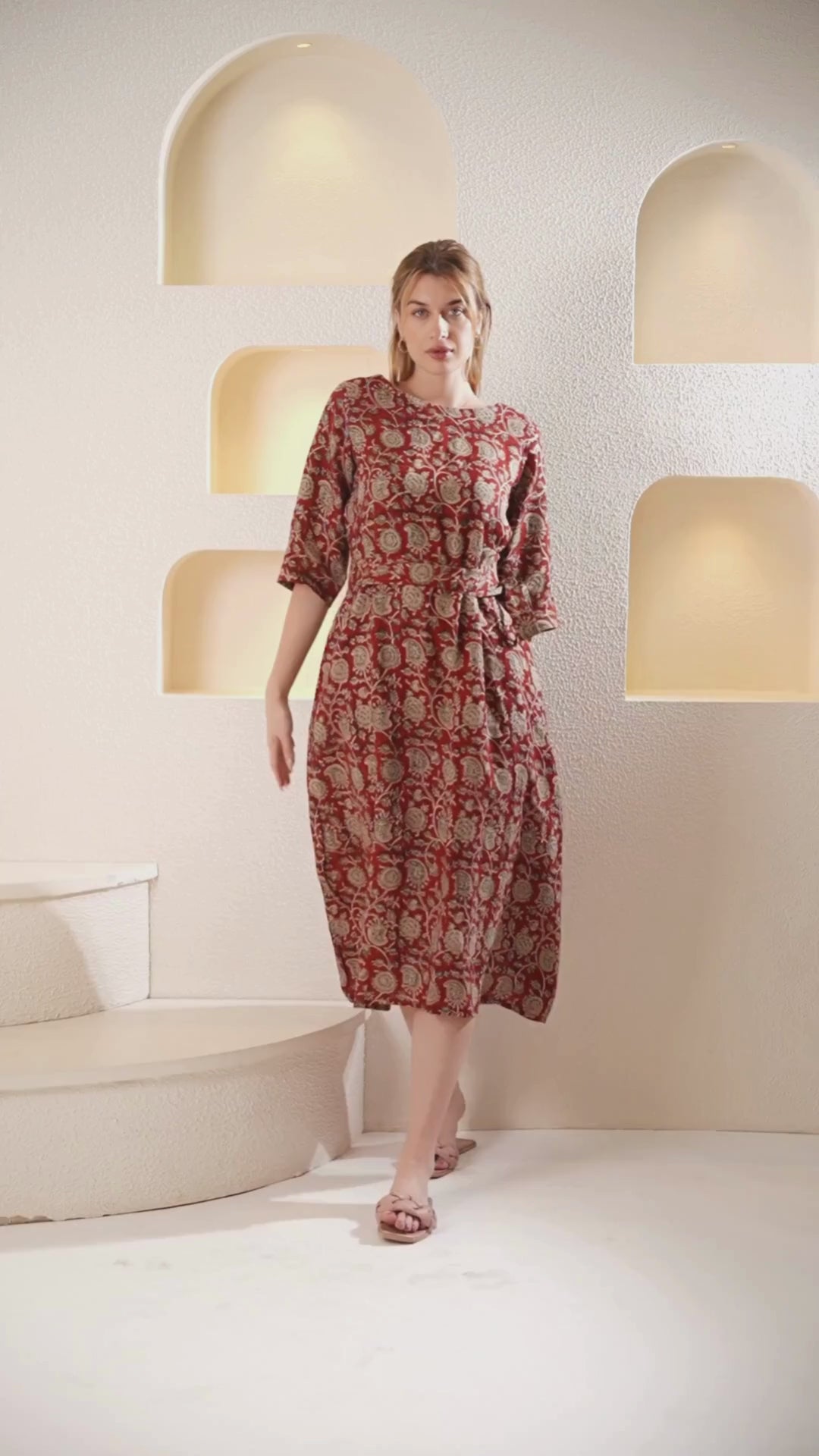 Video showcasing a flowing linen wrap dress, highlighting its elegant and versatile style in motion.