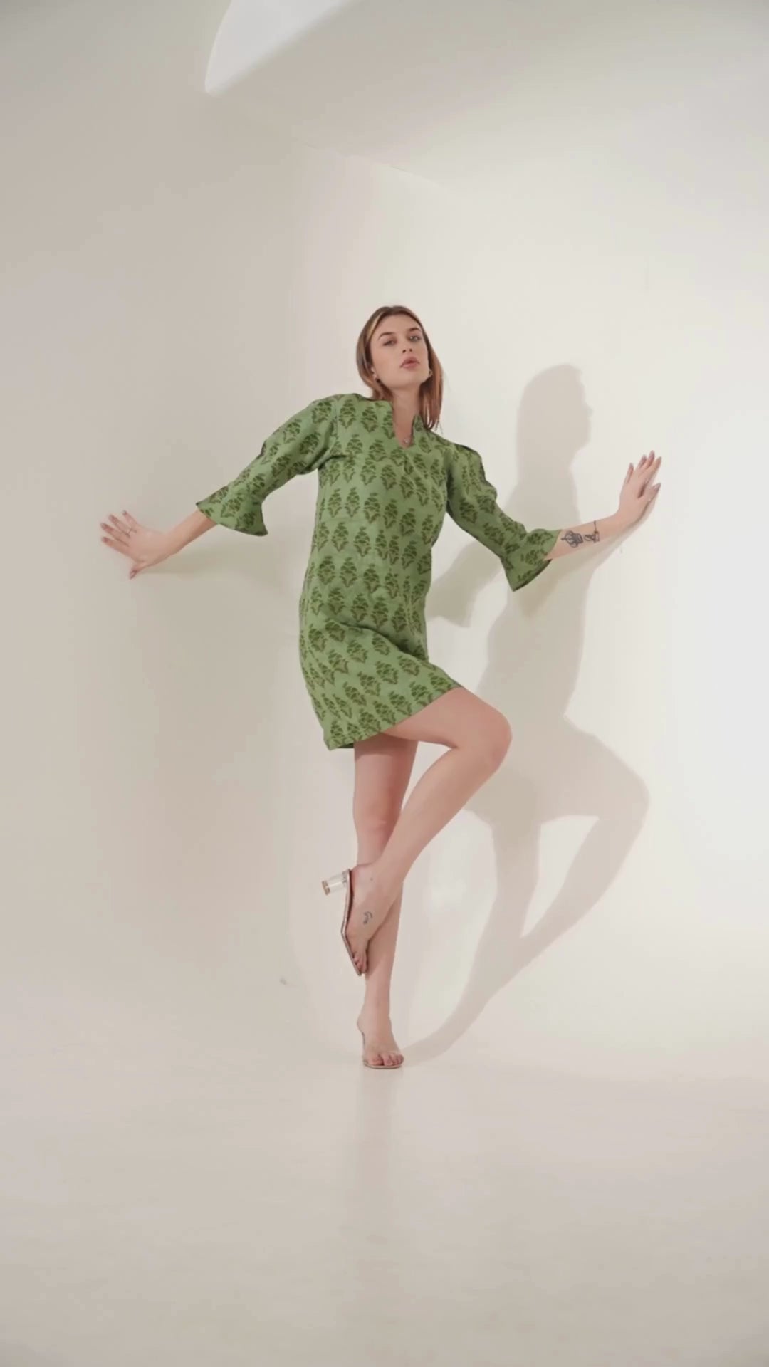 Video showcasing women in playful linen mini dresses, highlighting their breezy and stylish appeal.