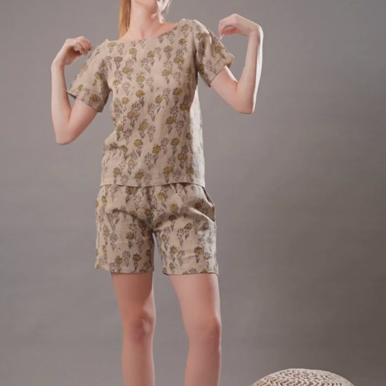 Video featuring a relaxed linen top and shorts outfit, highlighting its breezy and stylish summer look.